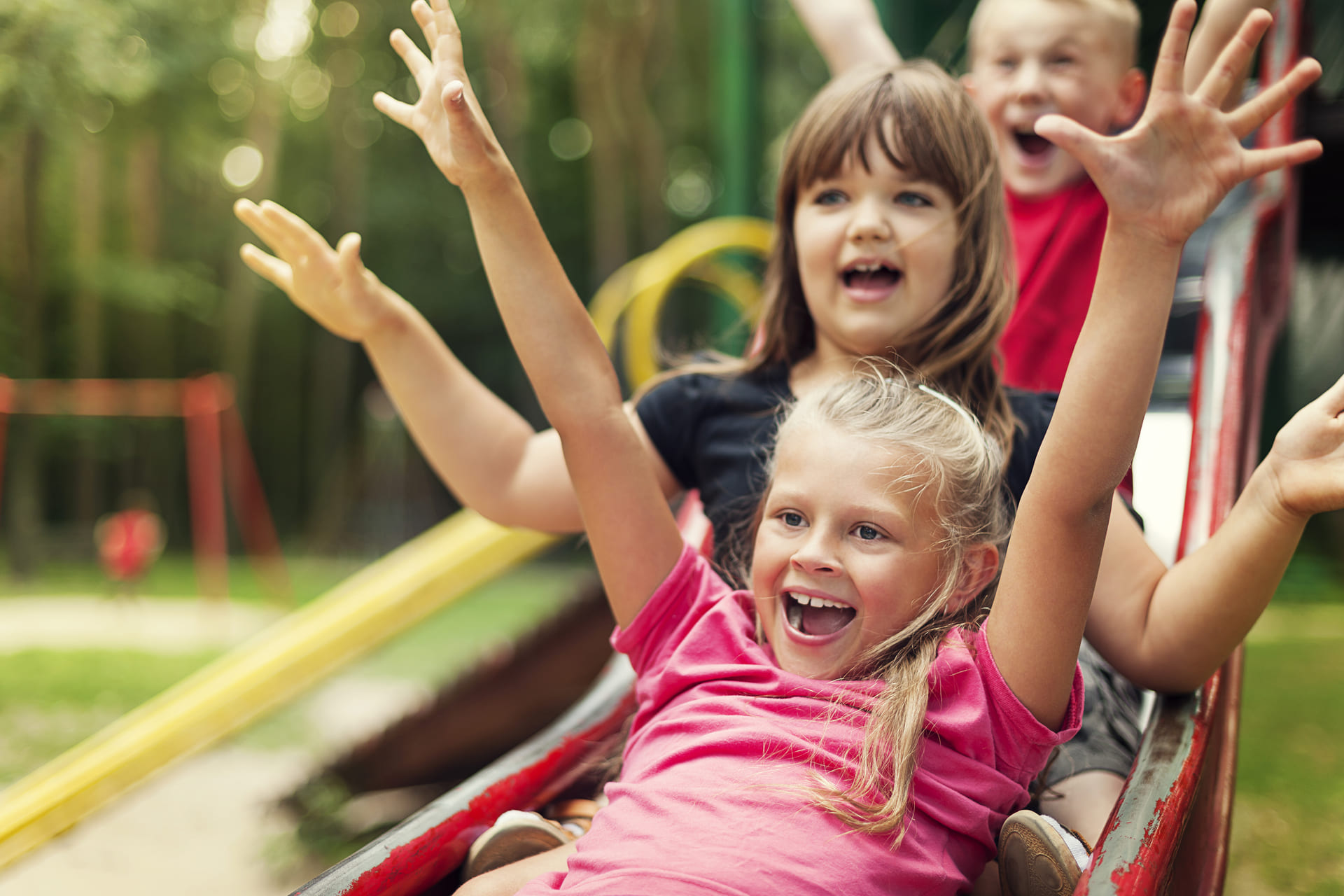 happy children on slide